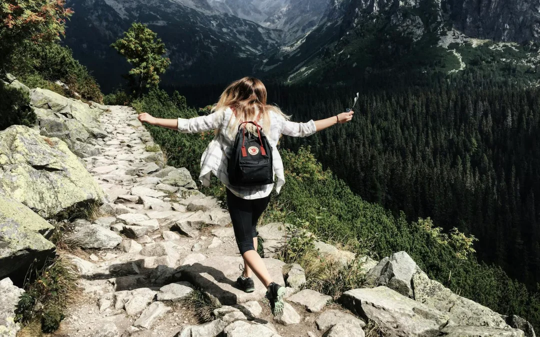 woman standing on cliff